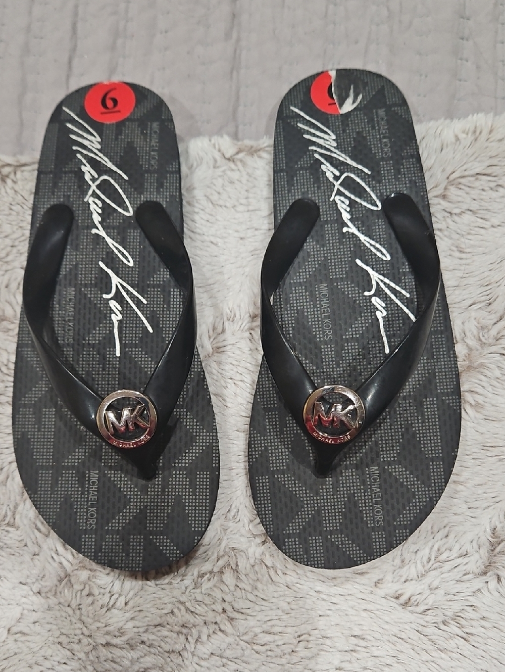 Michael Kors Black and Gold MK Logo Flip Flops